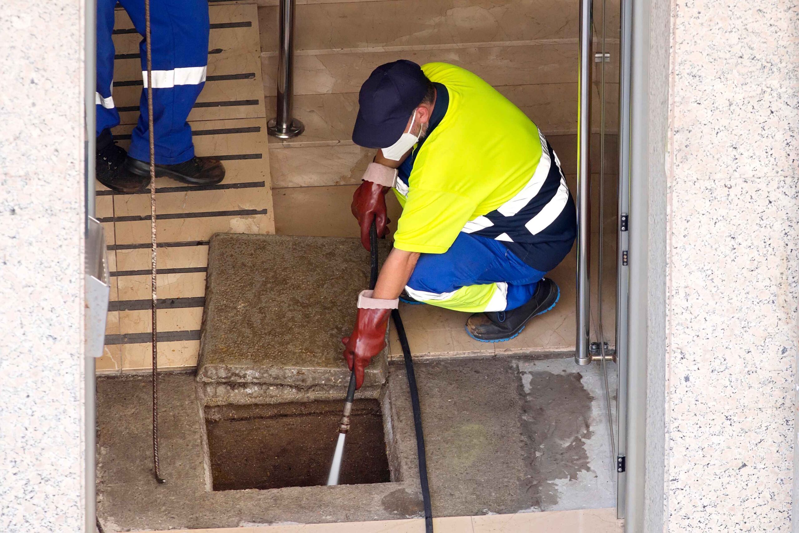 man doing a metro Denver drain cleaning