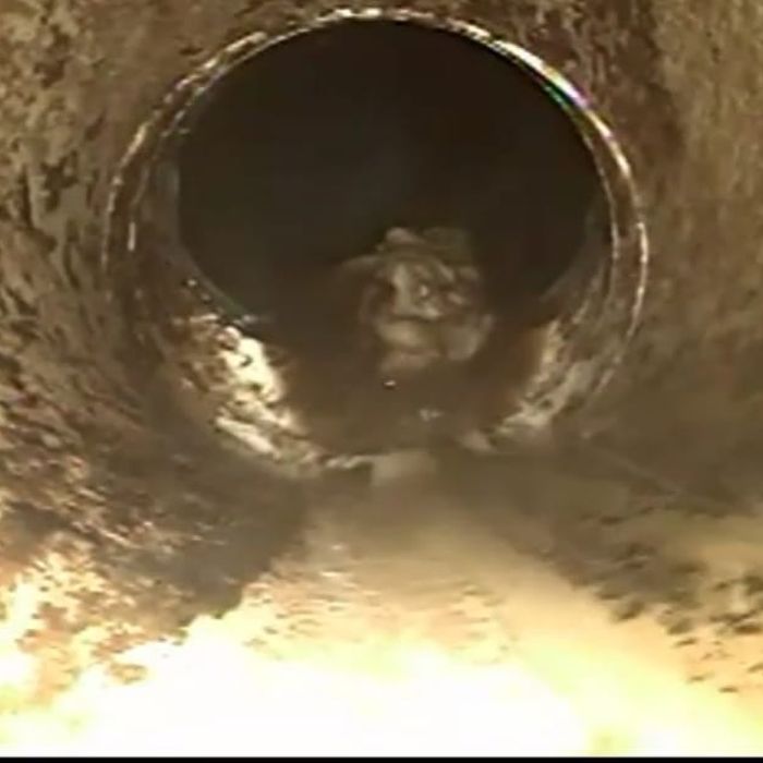 Sewer camera view inside a pipe with a distance readout