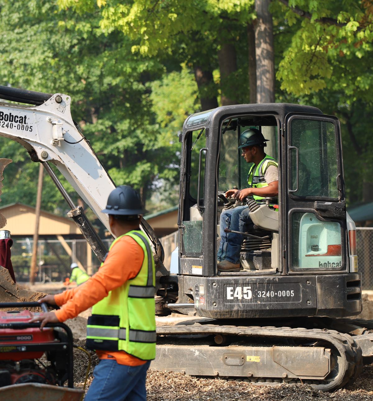 Sewer Experts crew with a mini excavator on a Denver sewer line job